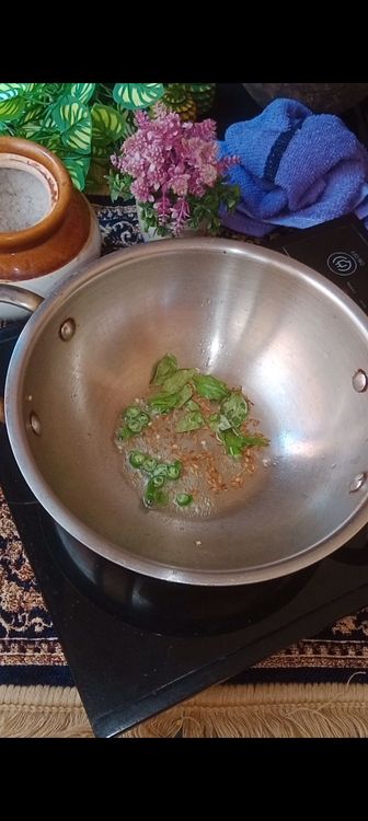 Step 1.1: In a wok , heat ghee, crackle some cumin seeds, green chillies and curry leaves