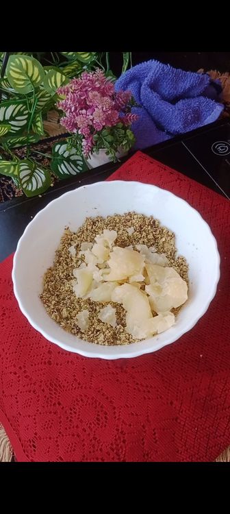 Step 1.1: Transfer to a bowl , add mashed boiled potatoes, paneer, coriander leaves and raisins