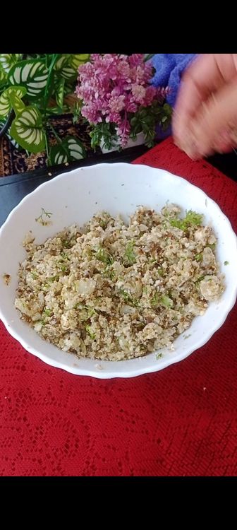 Step 1.3: Transfer to a bowl , add mashed boiled potatoes, paneer, coriander leaves and raisins