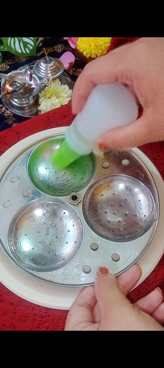 Step 1.1: After 25 min, keep idli steamer to heat on stove , check the batter , if it is dry add 1 tbsp of water more if required, mix well