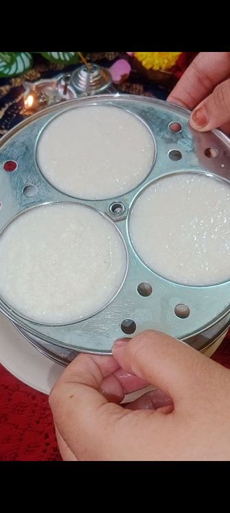 Step 1.2: After 25 min, keep idli steamer to heat on stove , check the batter , if it is dry add 1 tbsp of water more if required, mix well