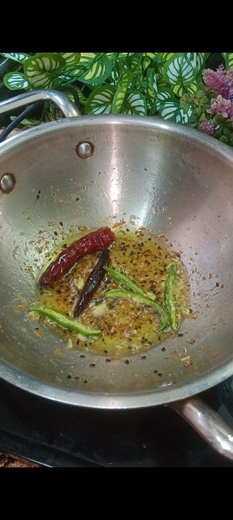 Step 1.1: Heat mustard oil , add PanchPoron, green chillies, dry red chilli and asafoetida