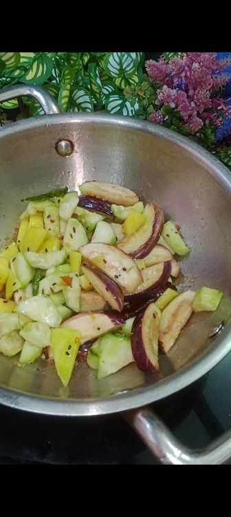 Step 1.2: Heat mustard oil , add PanchPoron, green chillies, dry red chilli and asafoetida