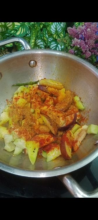 Step 1.1: Next add turmeric powder, red chilli powder salt and fried veggies