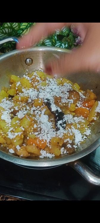 Step 1.1: Add Grated coconut and chopped spinach