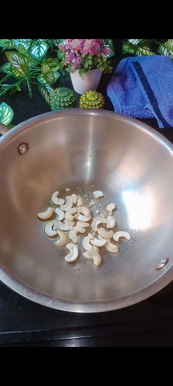 Step 1.1: In a wok , fry cashews with 1 tbsp ghee until golden brown