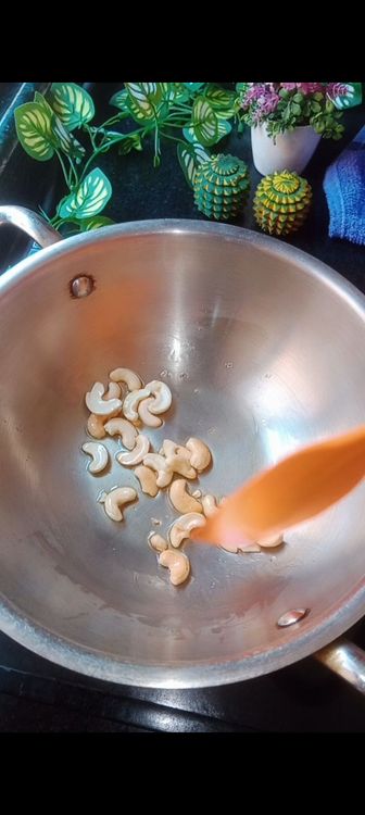 Step 1.2: In a wok , fry cashews with 1 tbsp ghee until golden brown