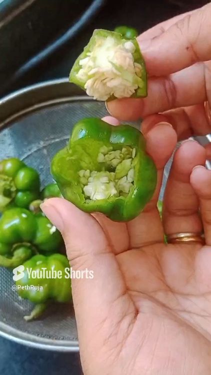 Step 1.2: Wash green capsicum really well and then cut the cap as shown below, deseed the capsicums and wash again to remove seeds completely