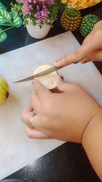 Step 1.2: Wash 500 g Guava , cut into halves , remove the seeds and chop it into cubes