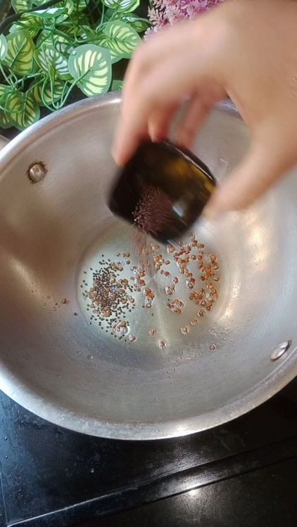 Step 1.2: Heat peanut oil in a wok, first add fenugreek seeds, when Fenugreek seeds crackle,  add mustard seeds