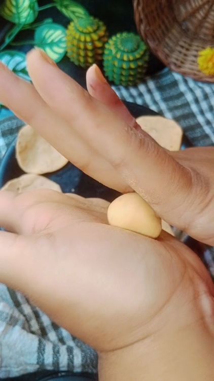 Step 1.1: Knead the dough again, take small piece of dough( about the size of a lemon) and flatten it into a thin disc using your fingers