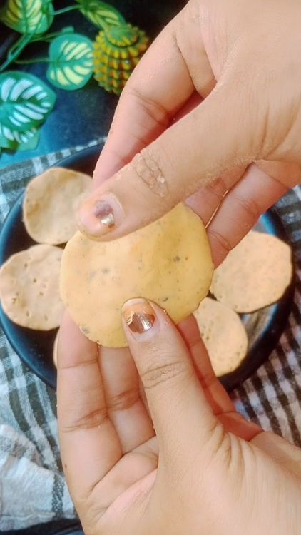 Step 1.3: Knead the dough again, take small piece of dough( about the size of a lemon) and flatten it into a thin disc using your fingers