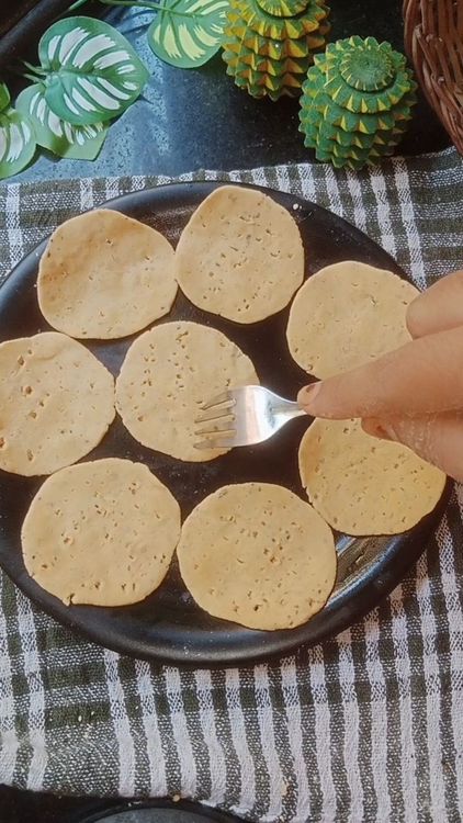 Step 1.1: Poke using fork or toothpick to avoid Thattai getting puffed while frying