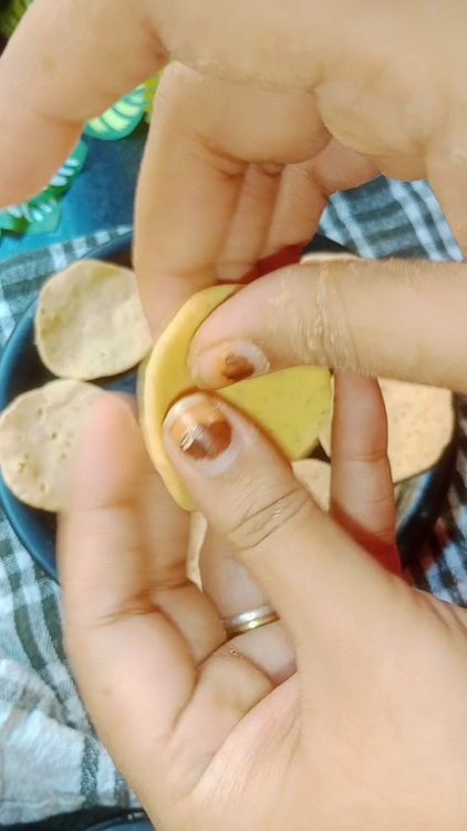 Step 1.2: Knead the dough again, take small piece of dough( about the size of a lemon) and flatten it into a thin disc using your fingers