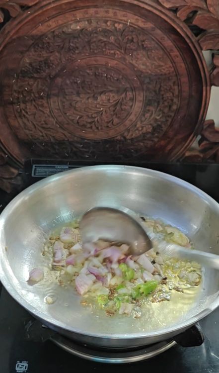 Step 1.1: Add chopped onion and green chillies