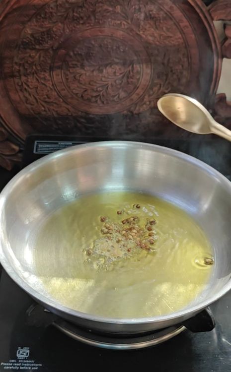 Step 1.1: Heat mustard oil in a pan and add asafoetida, cumin seeds, coriander seeds, and fenugreek seeds