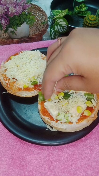 Step 1.1: Spread grated cheese over the veggies and sprinkle some mix herbs