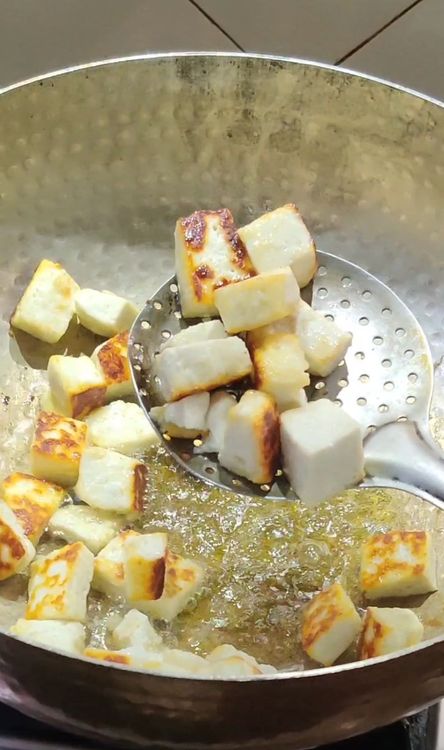Step 2.1: Cut the cottage cheese into cubes and fry in the ghee until golden