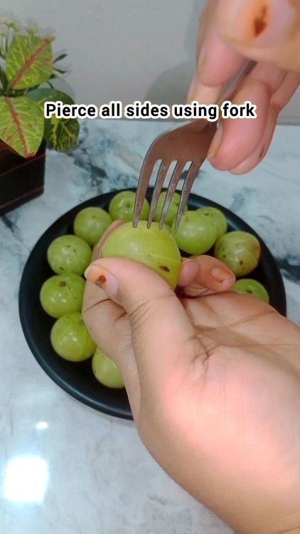 Step 1.2: Wash Amla, pierce using fork and soak them in salted water for 3 hrs