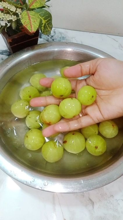 Step 1.4: Wash Amla, pierce using fork and soak them in salted water for 3 hrs
