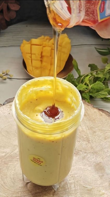 Step 1.2: Add fresh mango puree, honey, and vanilla extract to the soaked mixture
