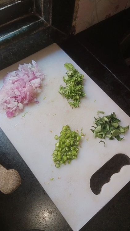 Step 1.1: Chop onion , curry leaves, green chillies and coriander leaves finely and add in a bowl