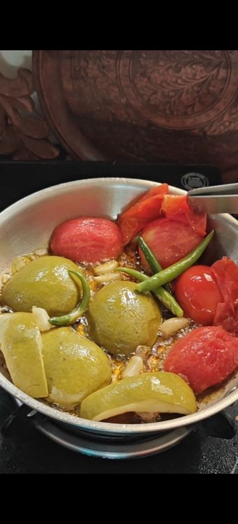 Step 1.1: Remove the peel from the cooked tomato and mango