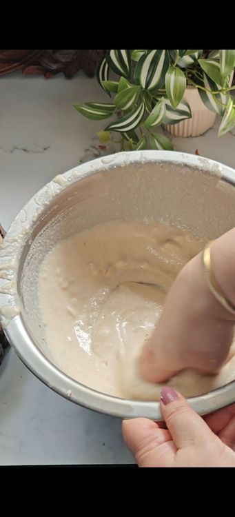 Step 1.2: Add chopped almonds, dry coconut, and crushed fennel seeds to the batter and mix well