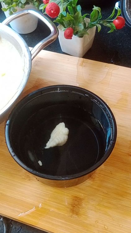 Step 1.1: Take a spoon of batter and put in water