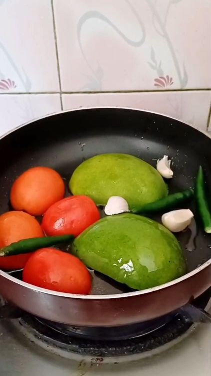Step 1.1: Cut tomato and raw Mango into halves