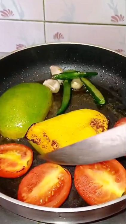 Step 1.2: Cut tomato and raw Mango into halves