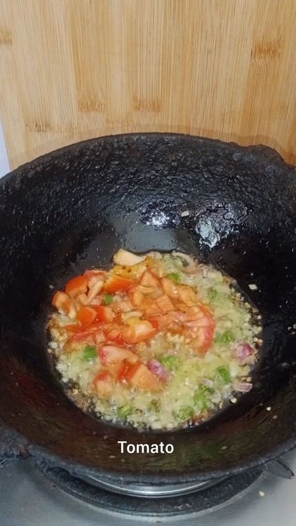 Step 1.1: Add the chopped tomatoes, red chilli powder, turmeric powder, asafoetida, and pav bhaji masala