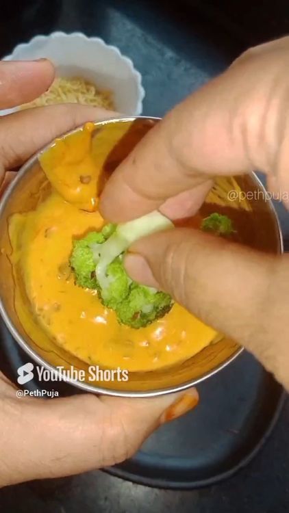 Step 2.1: Dip the upper side of each broccoli floret into the sauce