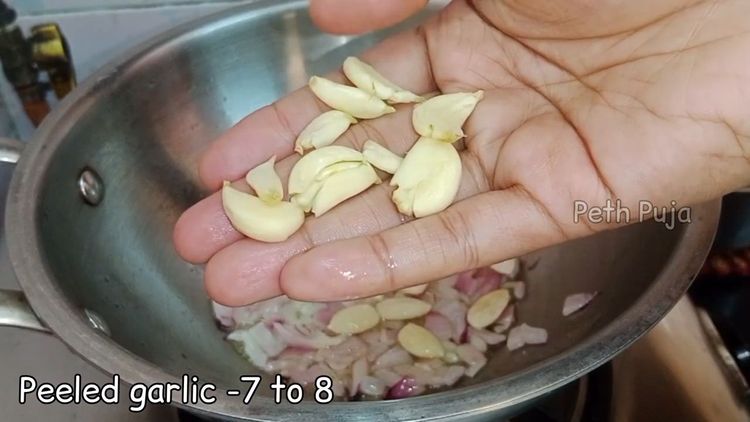 Step 1.1: Add blanched almonds and garlic pods, and toss for a few minutes