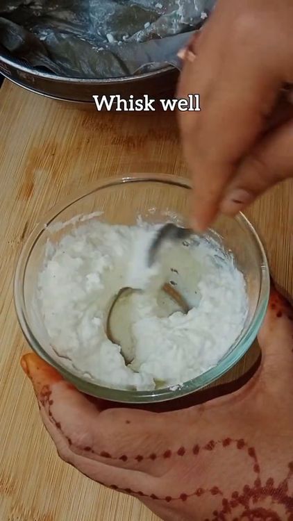Step 2.1: Add hung curd to a bowl and whisk well