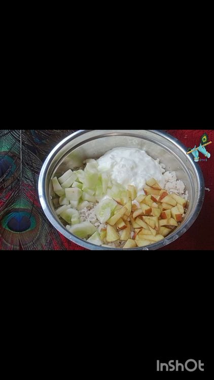 Step 1.1: Add curd, shredded coconut, chopped cucumber, apple, salt, sugar, pomegranate pods, and coriander leaves to the soaked poha