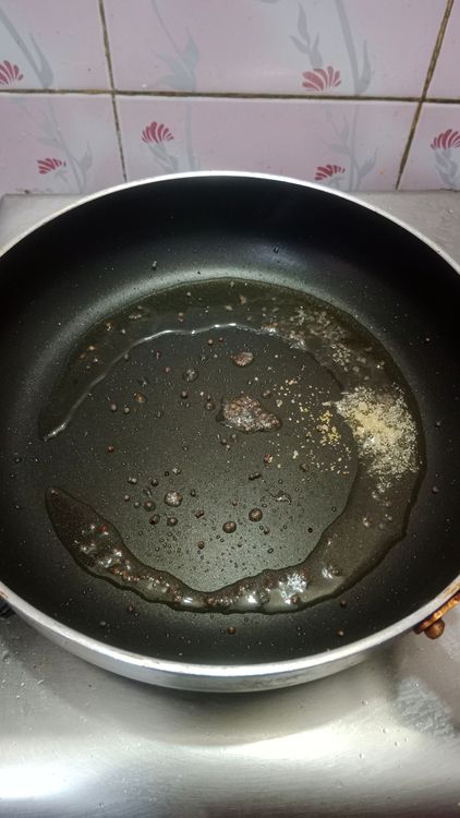 Step 1.1: Heat oil in a pan and add mustard seeds along with a pinch of asafoetida