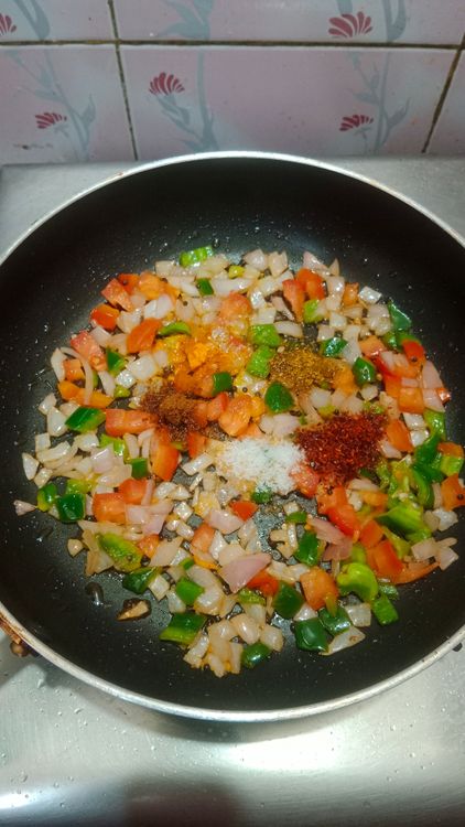 Step 1.1: Season the veggies with red chilli powder, turmeric powder, salt, a pinch of sugar, coriander powder, and cumin powder