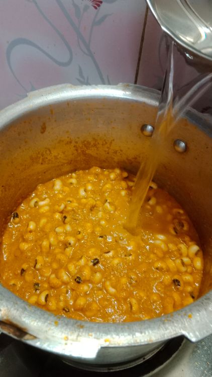 Step 3.3: Once the oil separates, Add the soaked black-eye peas, mix well