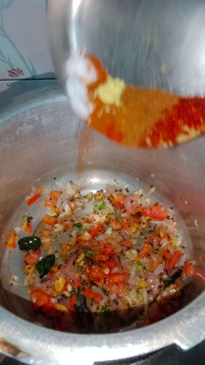 Step 2.2: Add turmeric powder, kashmiri red chilli powder, coriander powder, red chilli powder, cumin powder, asafoetida, kitchen king masala or pav bhaji masala, and salt