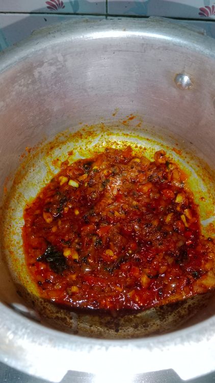 Step 2.1: Add 2 tablespoons of water to prevent the masalas from burning