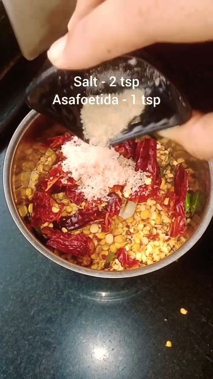 Step 1.2: Transfer the cooled mixture to a mixie jar, add asafoetida and salt