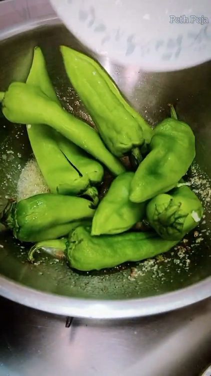 Step 1.1: Add the slit green chillies and coat them with the tempering mixture