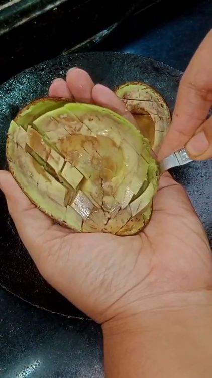 Step 1.1: Make small cuts in the avocado flesh and scoop it out onto a plate