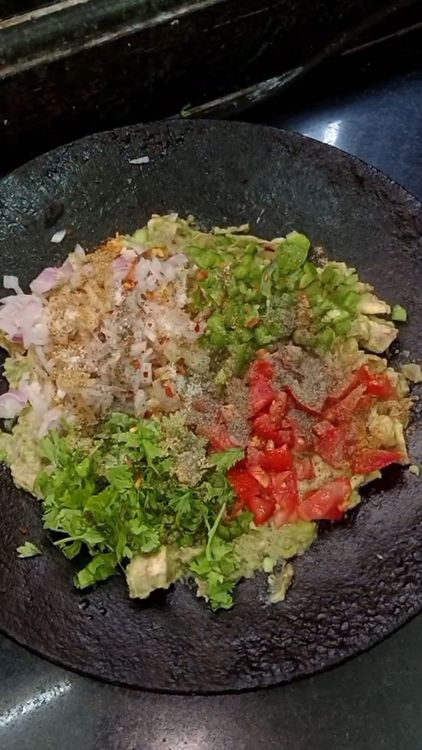 Step 1.1: Finely chop the onion, tomato, coriander leaves, and green bell pepper