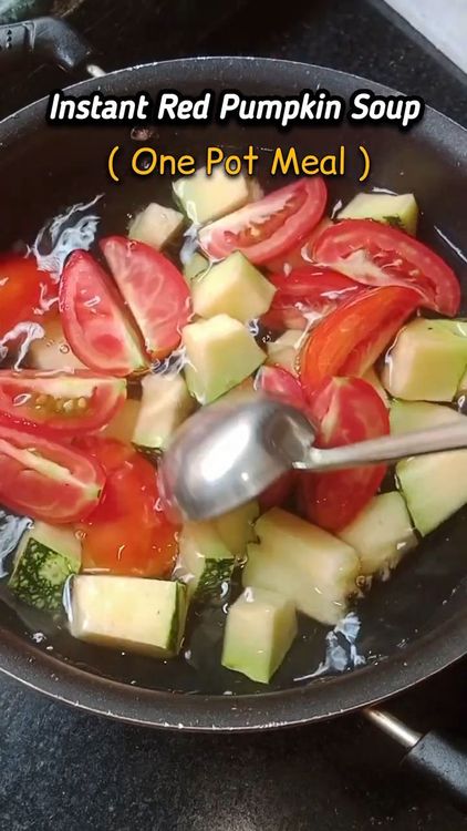 Step 1.1: Transfer the red pumpkin and tomatoes to a deep-bottom pan and add 3 cups of water