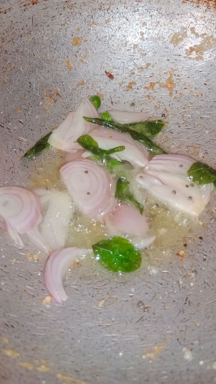 Step 1.1: Once the mustard seeds flutter, add sliced onion and finely chopped green chilli
