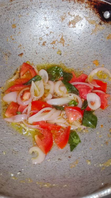 Step 1.1: Add chopped tomato and fry until it softens, which will take about a minute on low flame