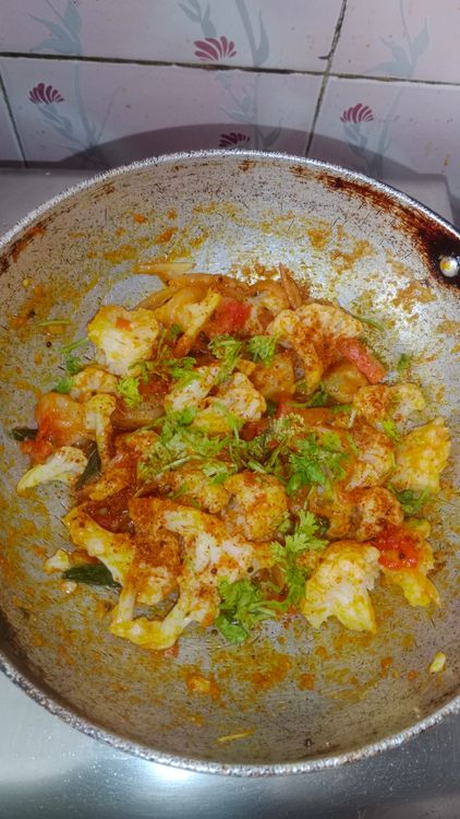 Step 1.1: Add pav bhaji masala and chopped coriander leaves