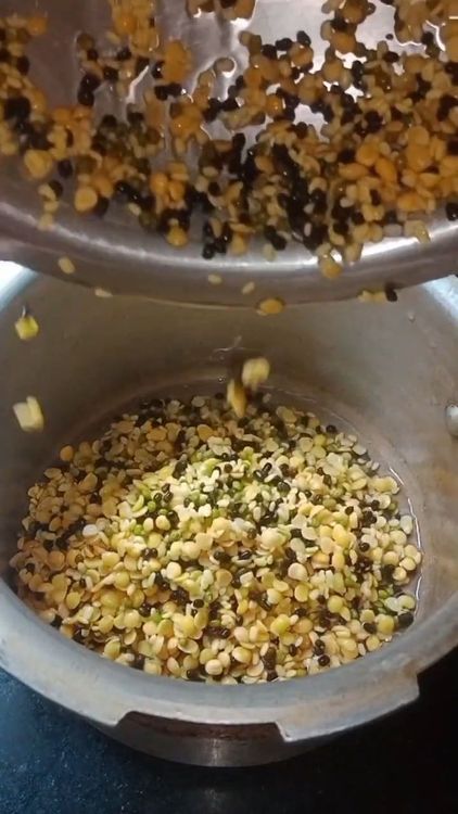 Step 1.1: Transfer the soaked dal to a pressure cooker with 500 ml water
